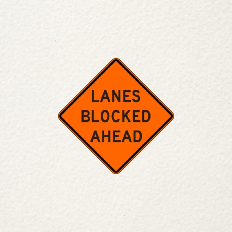 lanes blocked ahead sign