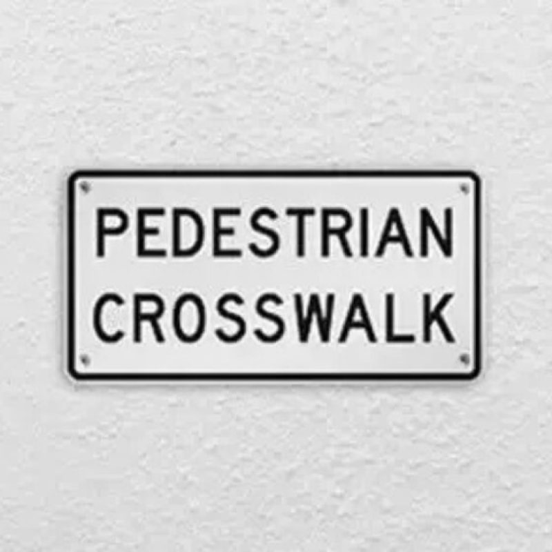 perstrain crooswalk sign
